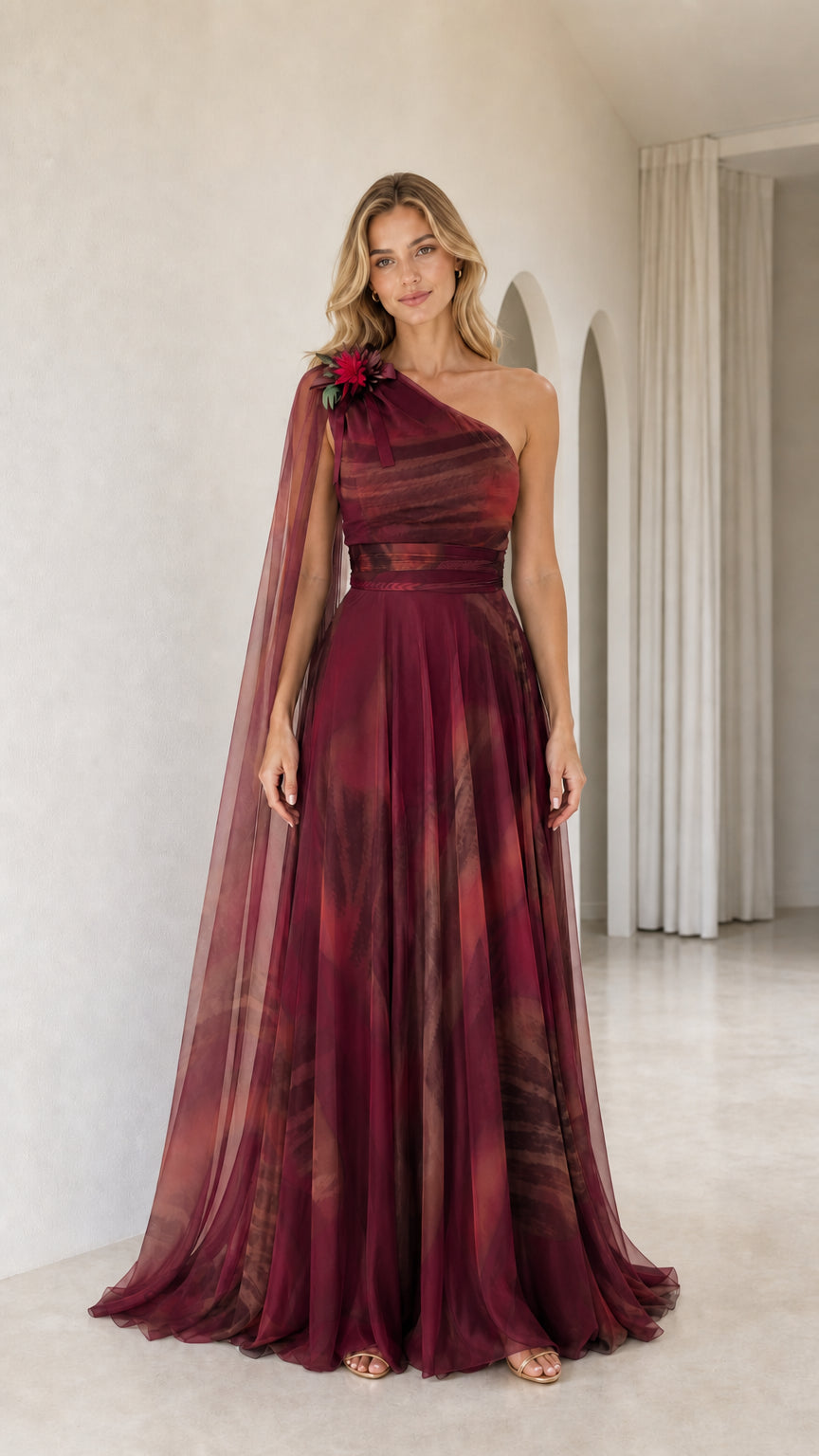 Full front view of burgundy wine red one-shoulder cape maxi gown