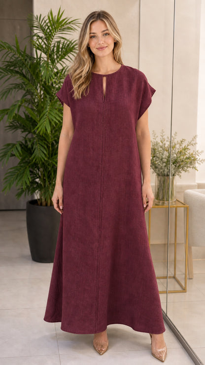 Woman wearing burgundy wine-colored cap sleeve maxi dress