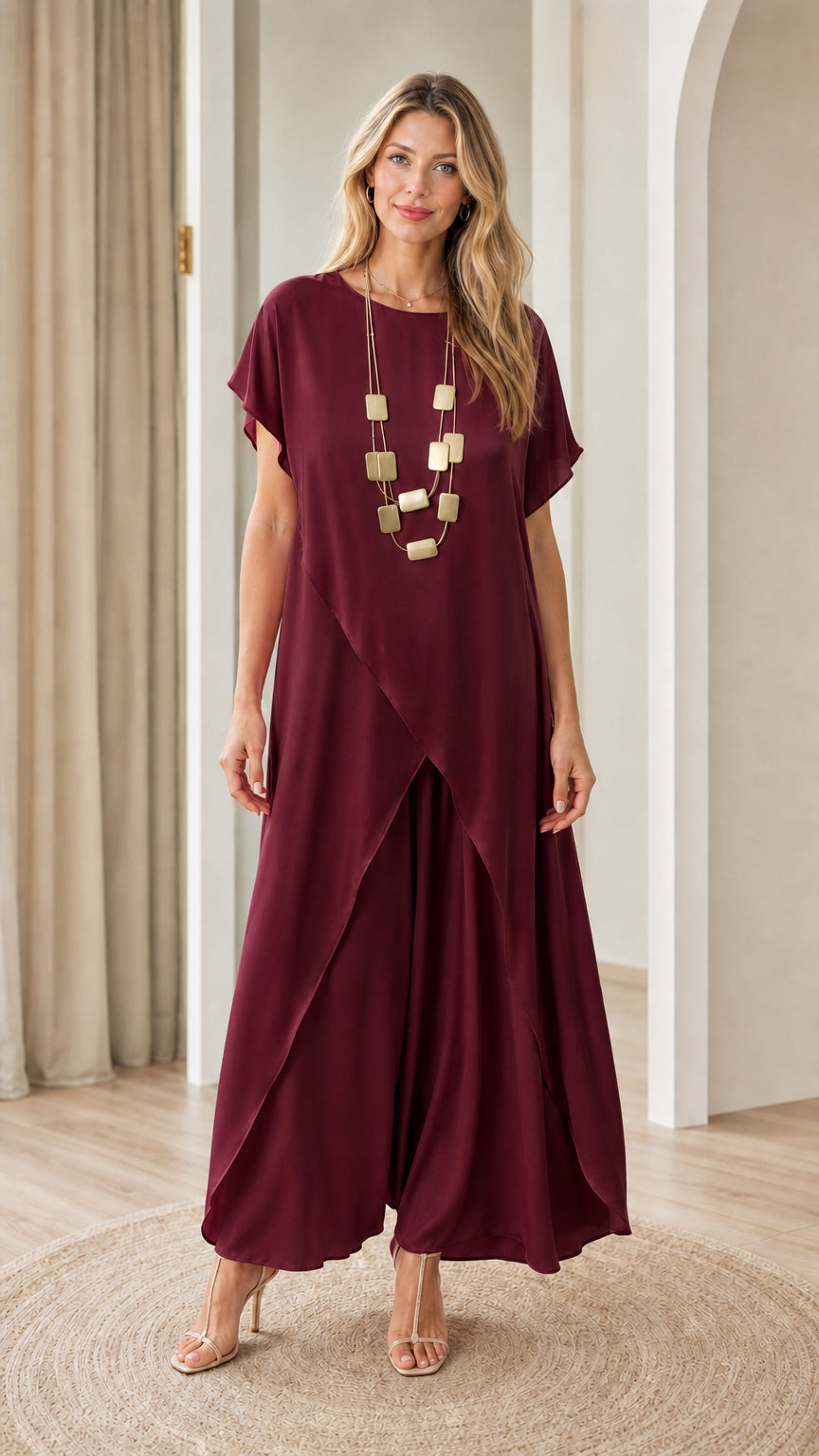 Full front view of model wearing burgundy wine-colored tulip tunic and matching wide-leg trousers
