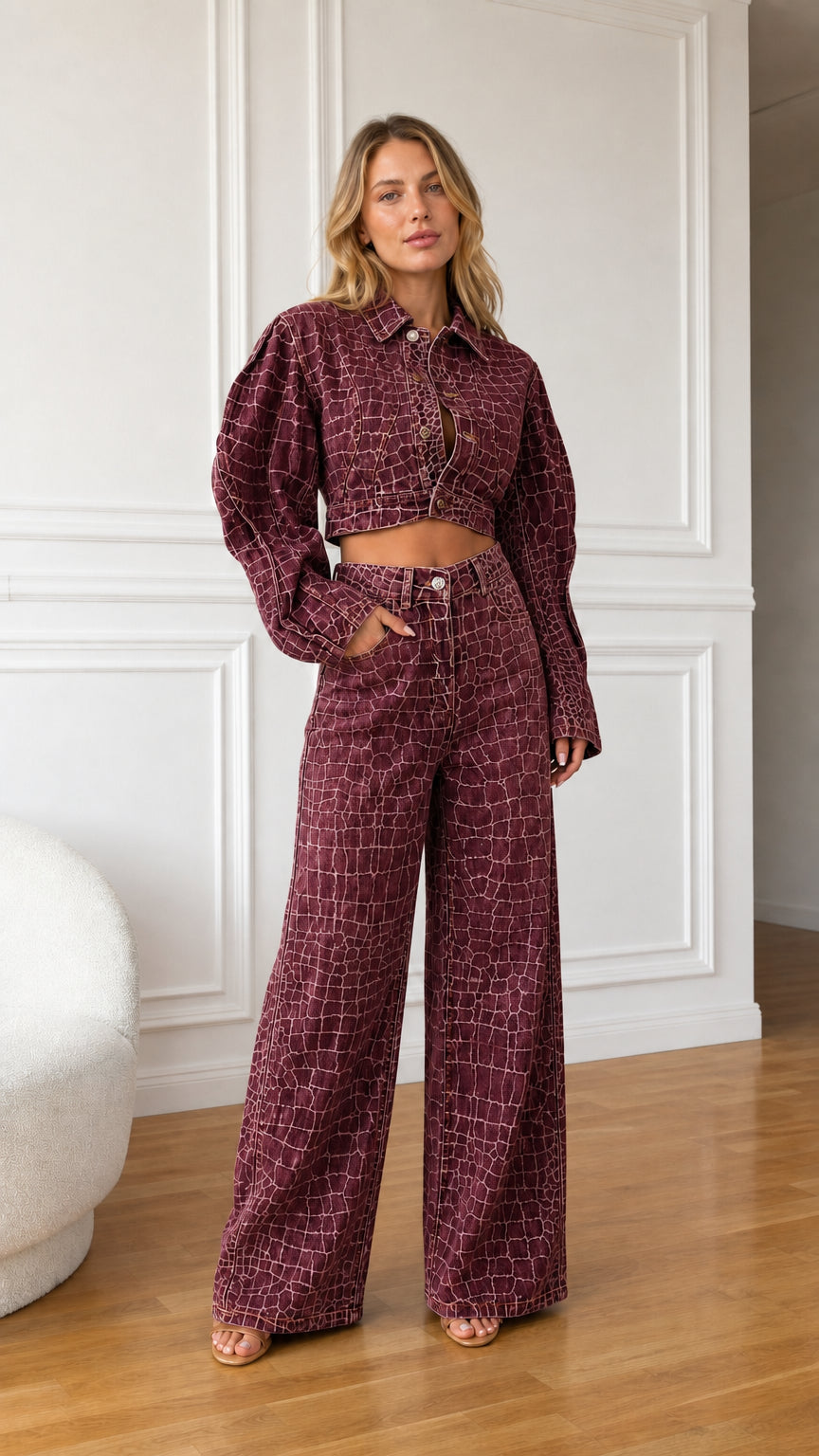 Model wearing burgundy plum crocodile embossed denim cropped jacket and wide leg pants set