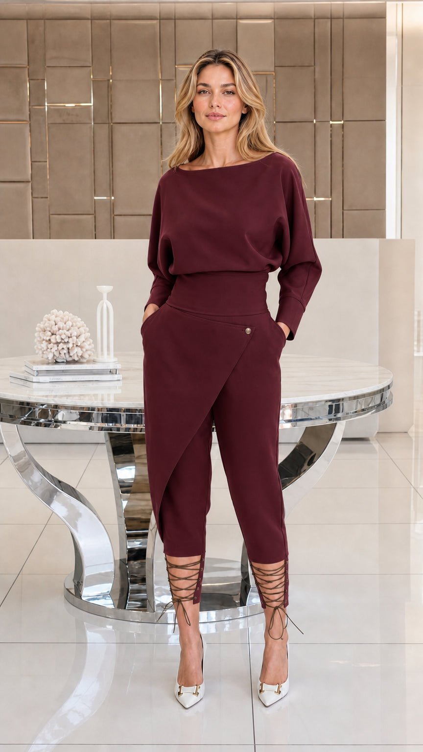 Woman wearing burgundy wine red batwing top and matching wrap trousers set