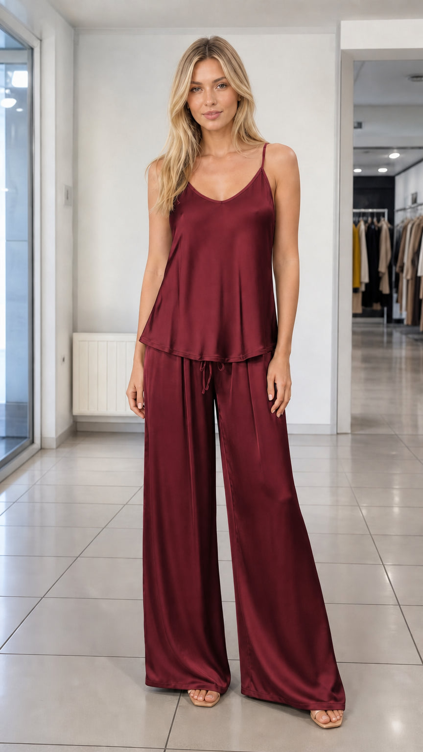 Woman wearing Burgundy wine red satin cami and wide-leg trousers set