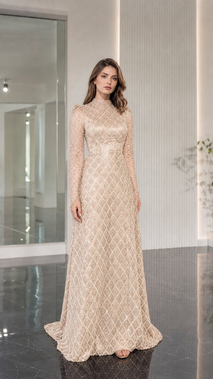 Model wearing champagne gold embellished high neck formal gown