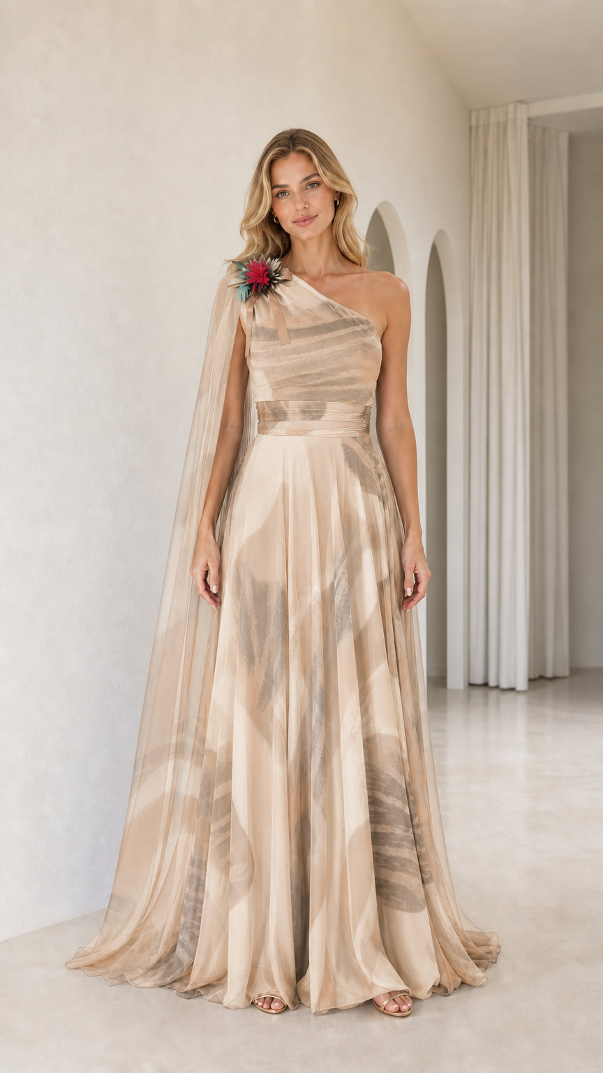 Full front view of champagne gold printed one-shoulder cape formal gown