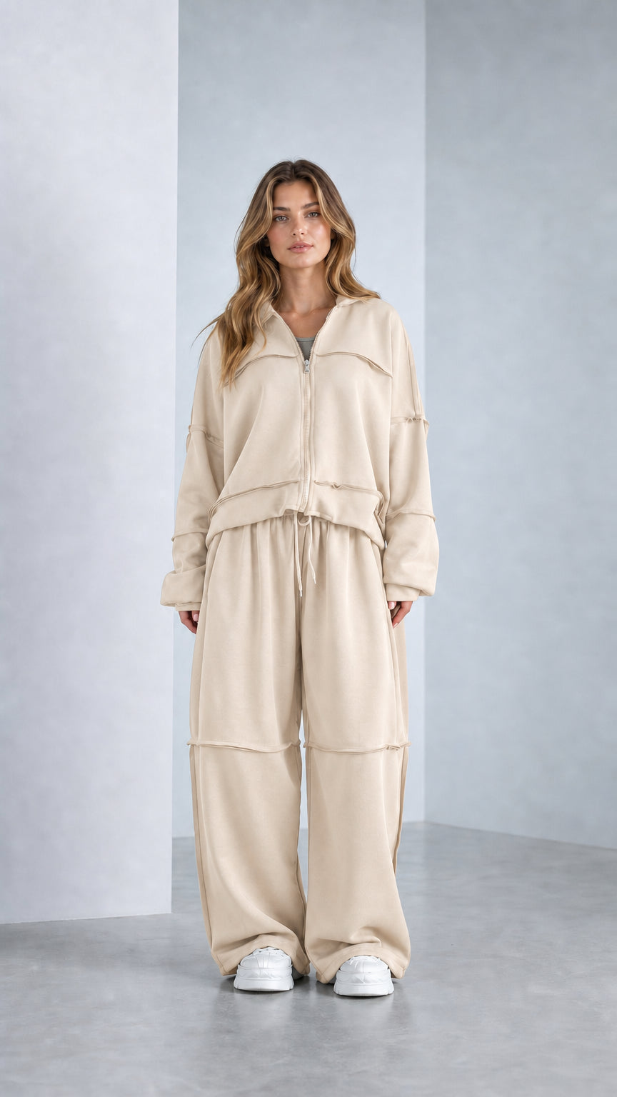 Full-length studio shot of model wearing Cream Beige zip-up matching tracksuit set