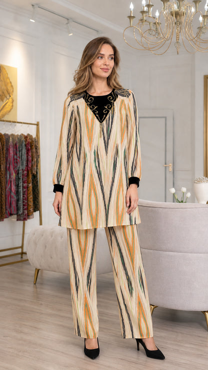 Model wearing Champagne beige embroidered tunic and matching trousers