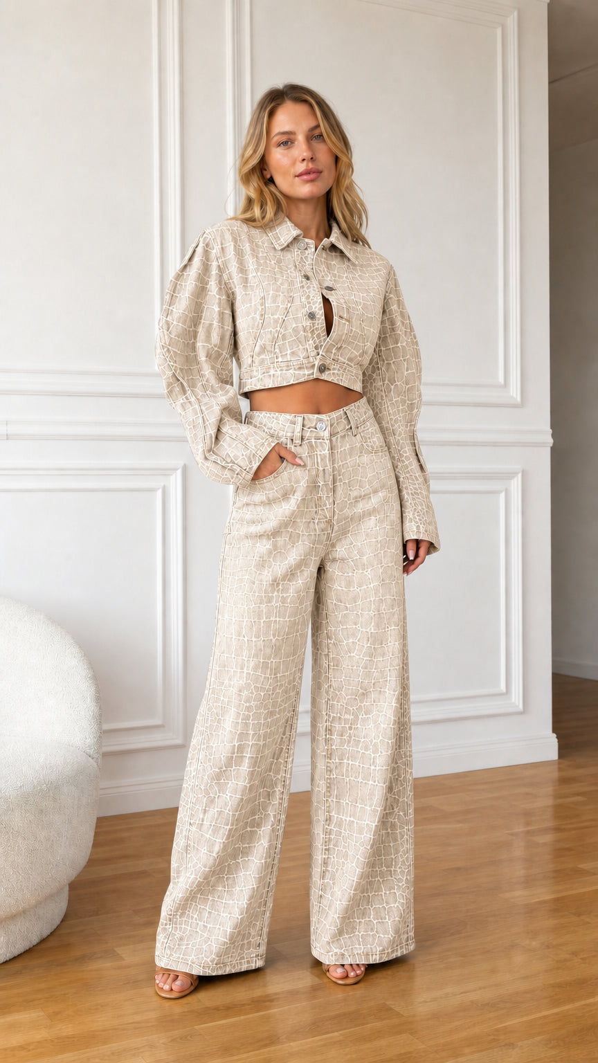 Model wearing beige oatmeal crocodile embossed denim cropped jacket and wide leg pants set